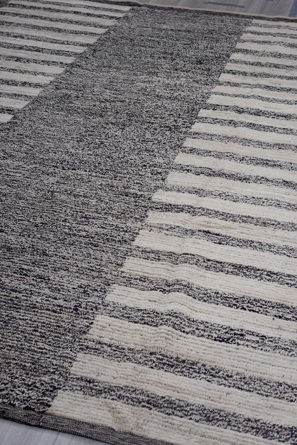 7' x 11' one-of-a-kind handmade vintage Tulu large size rug. Color palette: charcoal, ivory, gray, black