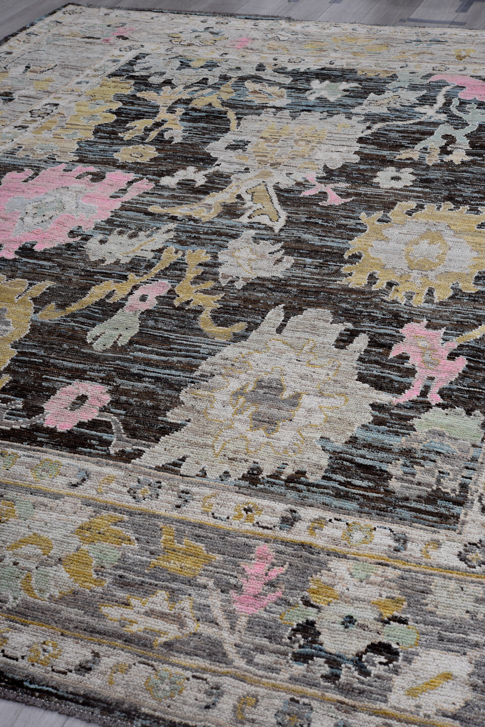 9' x 12' one-of-a-kind handmade vintage Oushak large size rug. Color palette: charcoal, ivory, gold, pink, pale blue, taupe