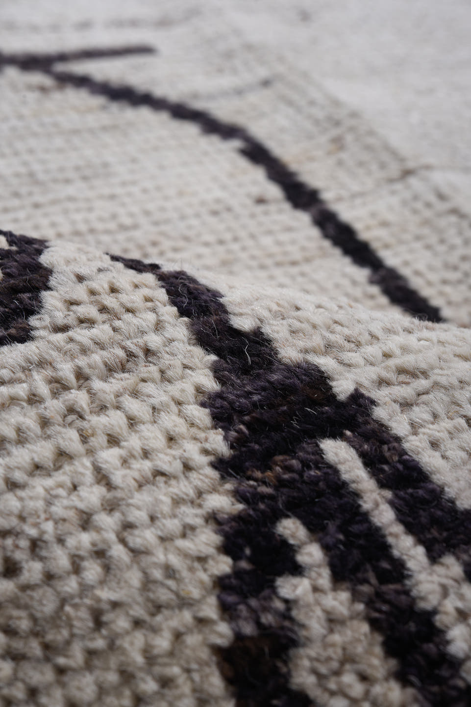 9' x 11' one-of-a-kind handmade vintage Tulu large size rug. Color palette: ivory, charcoal, taupe, gray, black, beige