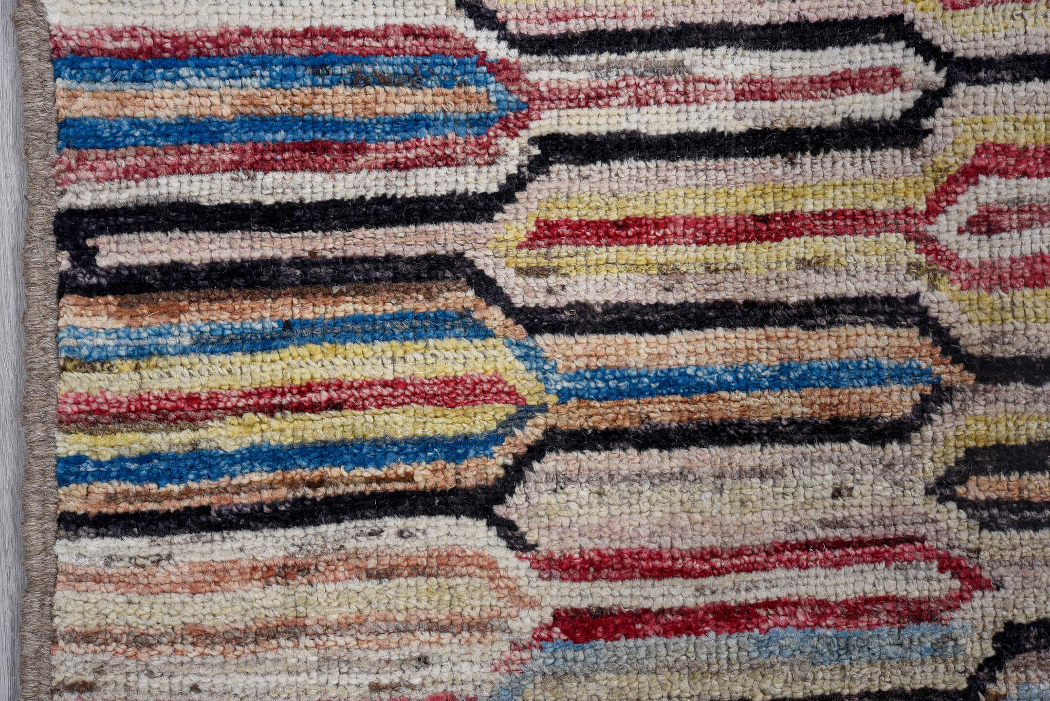 7' x 9' one-of-a-kind handmade vintage Tulu large size rug. Color palette: ivory, rose, charcoal, sky blue, gold, coral