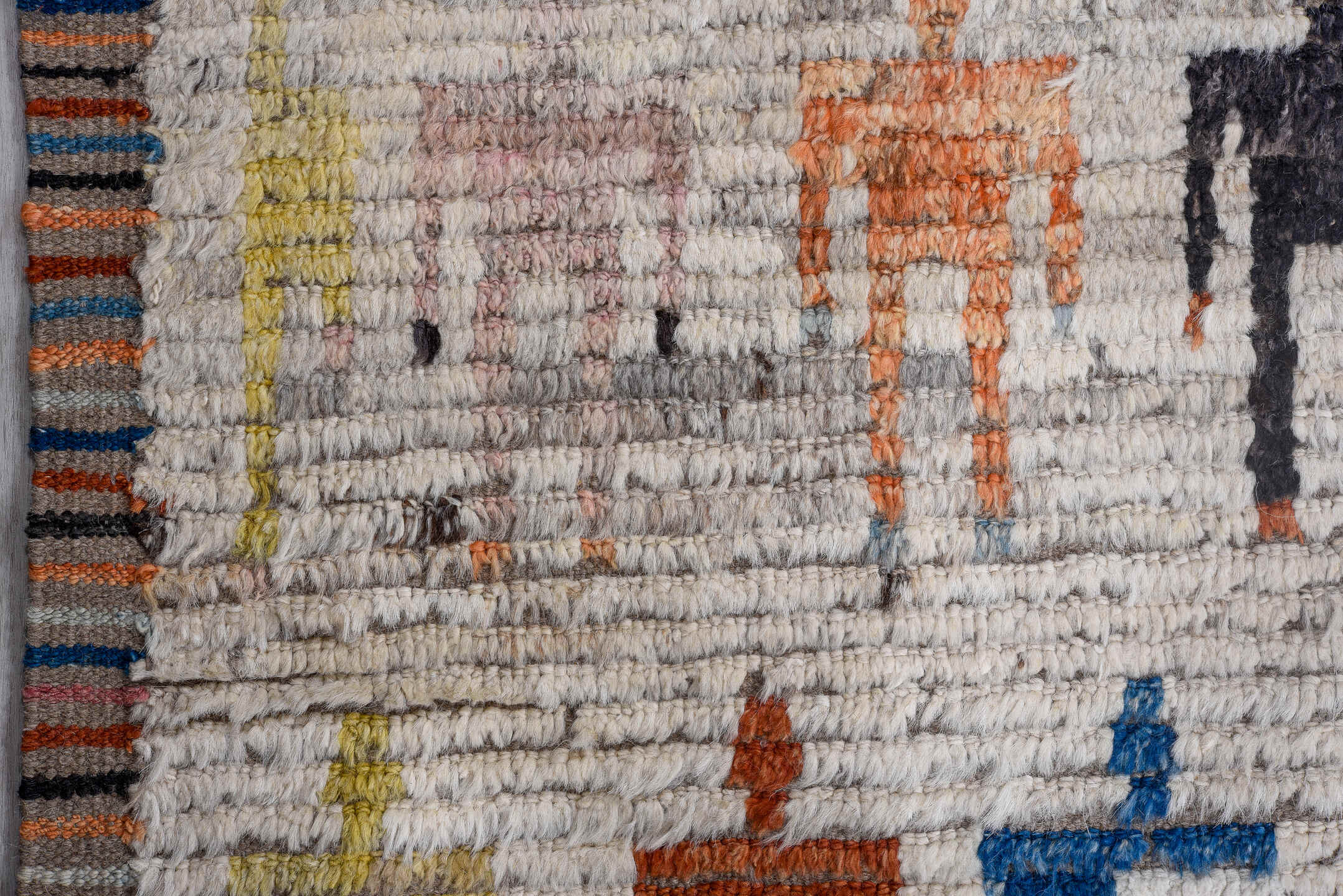 13' x 16' one-of-a-kind handmade vintage Tulu oversize rug. Color palette: ivory, gray, pink, charcoal, sky blue, gold