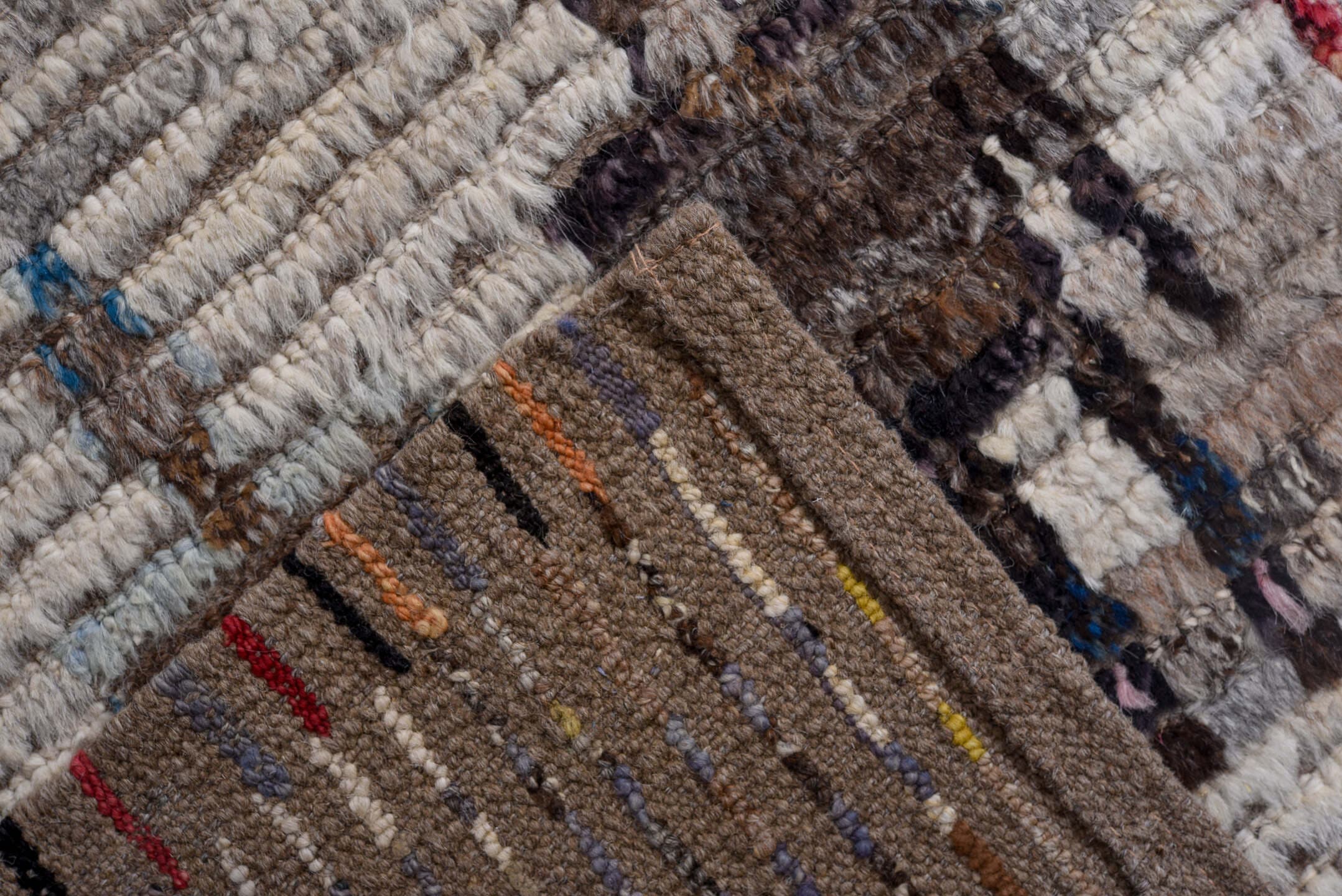 13' x 16' one-of-a-kind handmade vintage Tulu oversize rug. Color palette: ivory, gray, pink, charcoal, sky blue, gold