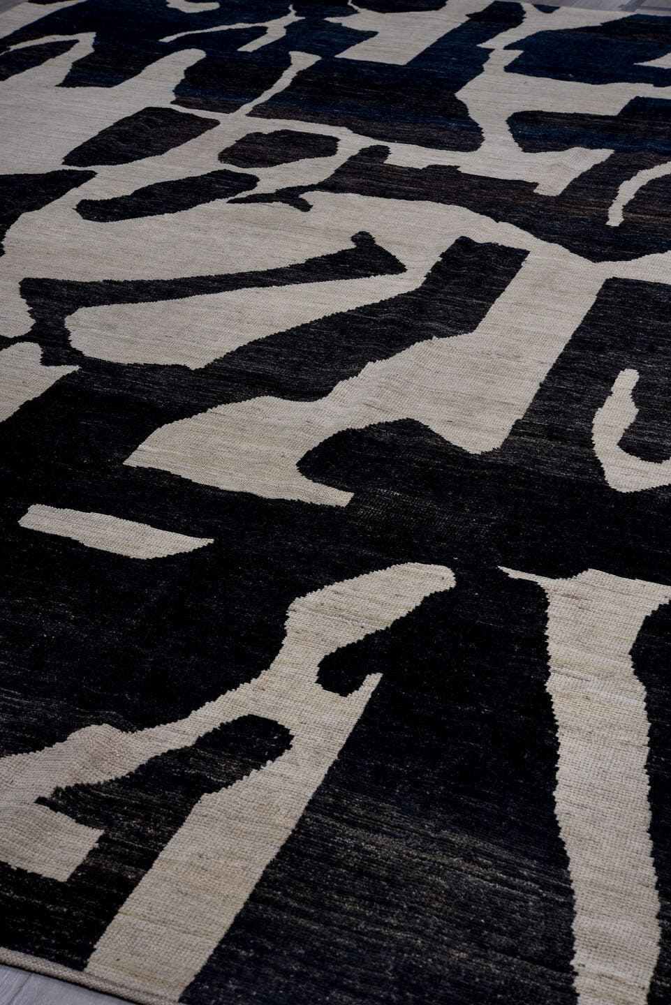 10' x 14' one-of-a-kind handmade vintage Tulu rug. Color palette: ivory, charcoal, black, slate, gray