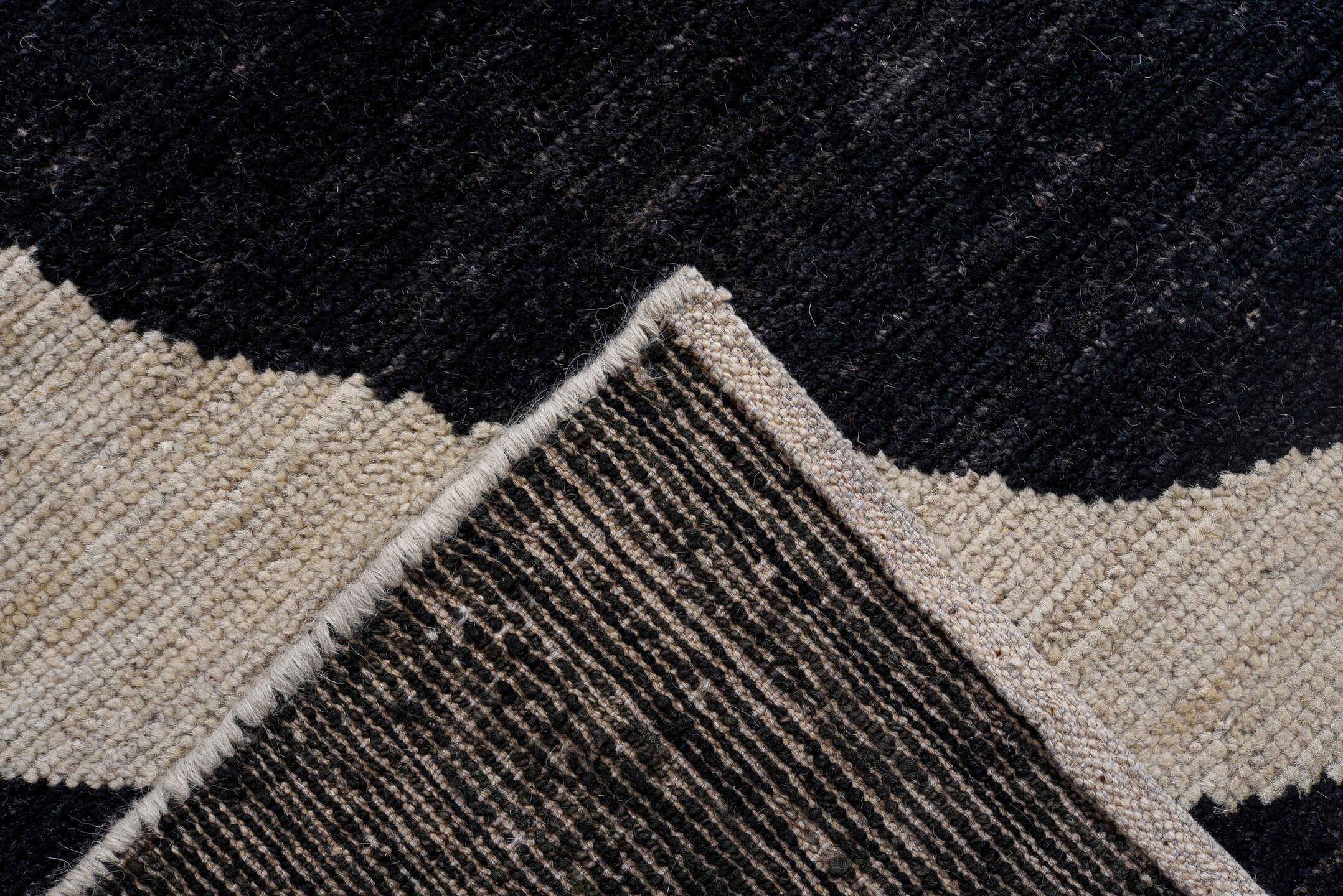 10' x 14' one-of-a-kind handmade vintage Tulu rug. Color palette: ivory, charcoal, black, slate, gray