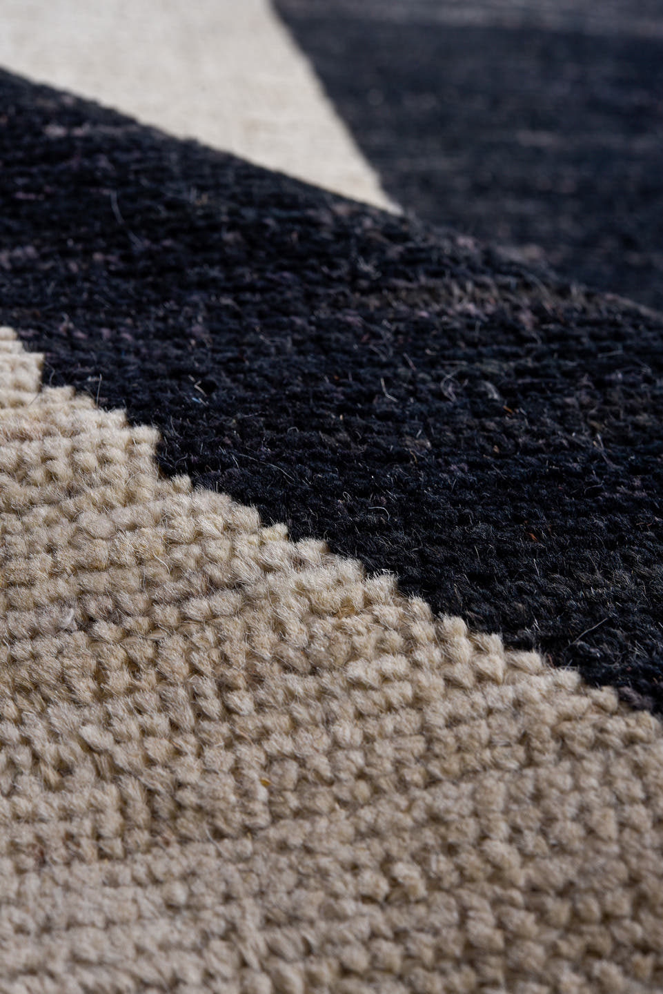 10' x 14' one-of-a-kind handmade vintage Tulu rug. Color palette: ivory, charcoal, black, slate, gray