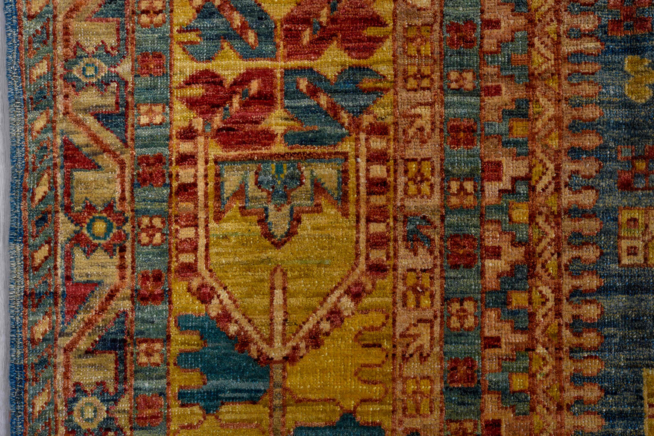 8' x 9' one-of-a-kind handmade vintage Afghan rug. Color palette: blue, gold, rust, ivory, teal, crimson, camel, brown