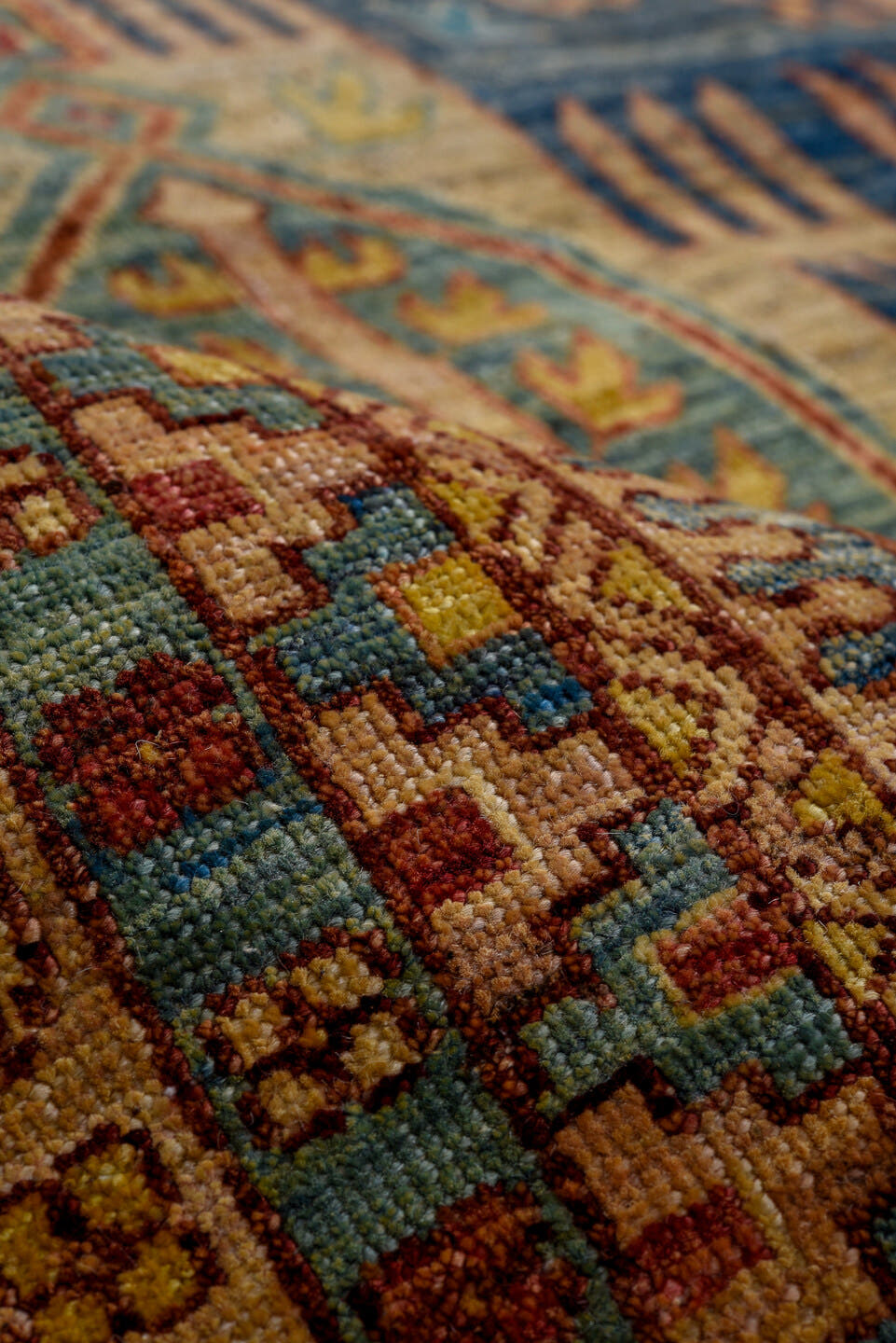 8' x 9' one-of-a-kind handmade vintage Afghan rug. Color palette: blue, gold, rust, ivory, teal, crimson, camel, brown
