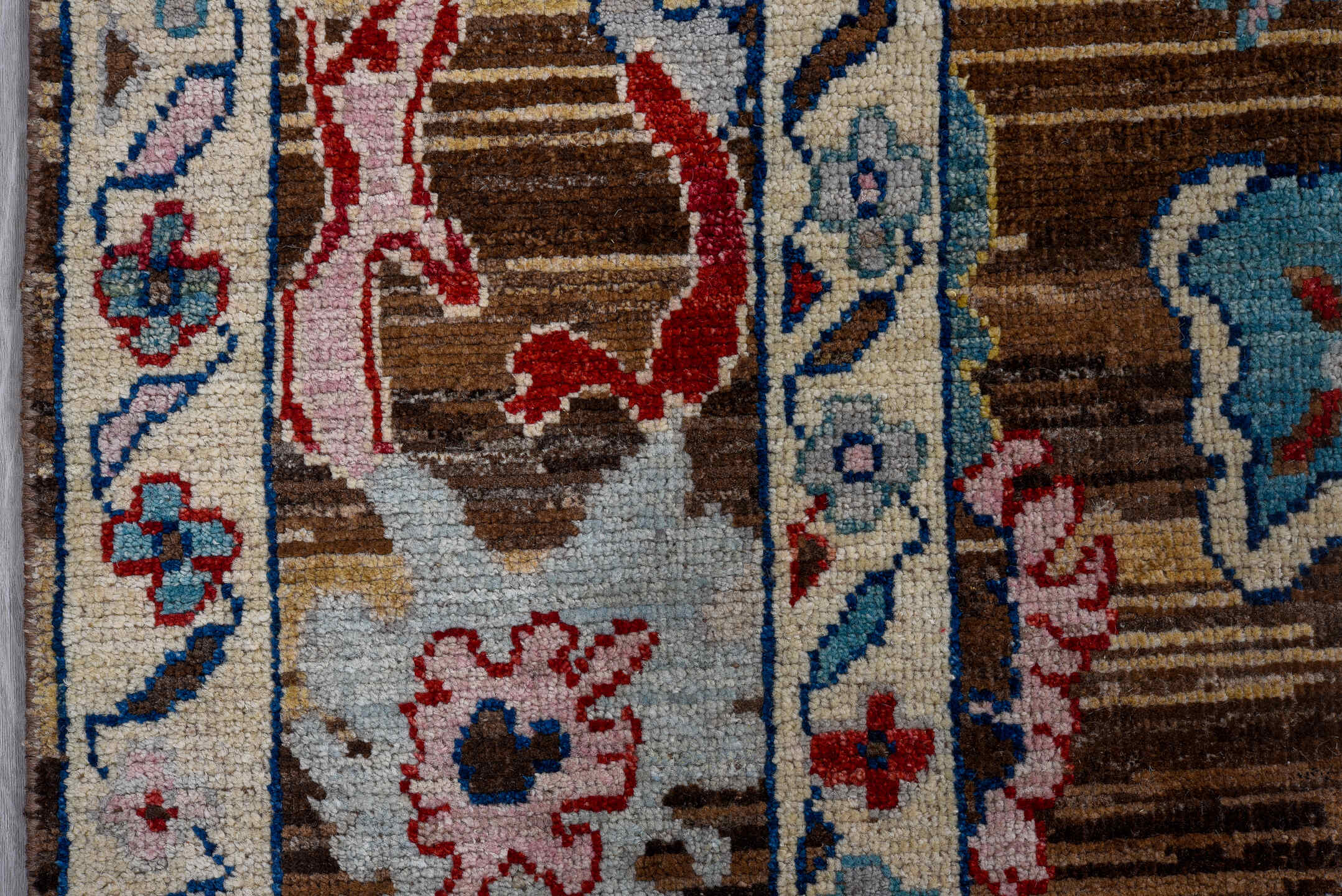 5' x 7' one-of-a-kind handmade vintage Afghan medium size rug. Color palette: brown, ivory, sky blue, crimson, gold, blush