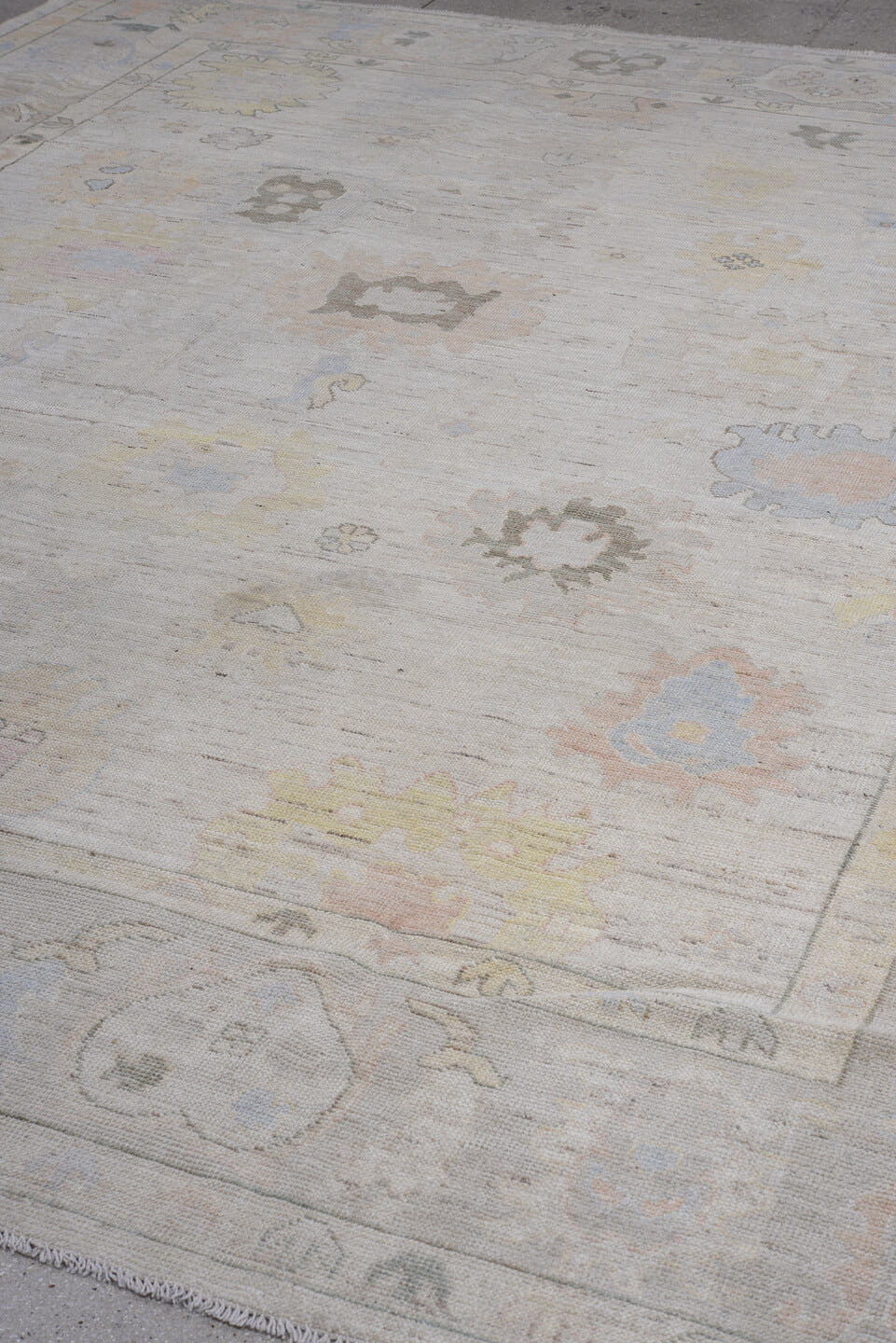 9' x 12' one-of-a-kind handmade vintage Oushak large size rug. Color palette: ivory, pale blue, taupe, peach, soft gold