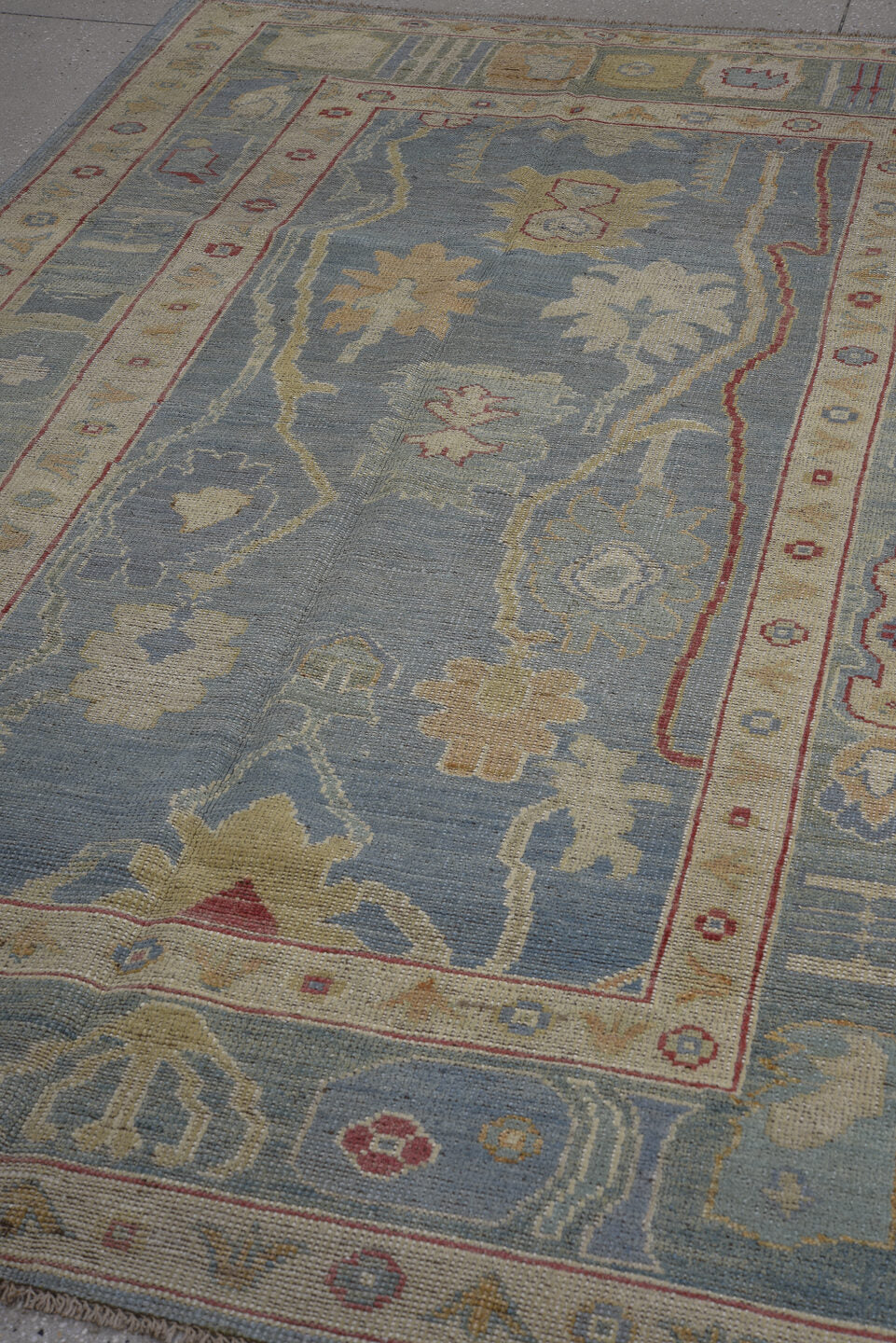 4' x 8' one-of-a-kind handmade vintage Oushak rug. Color palette: sky blue, ivory, beige, rust, sage, gold, slate