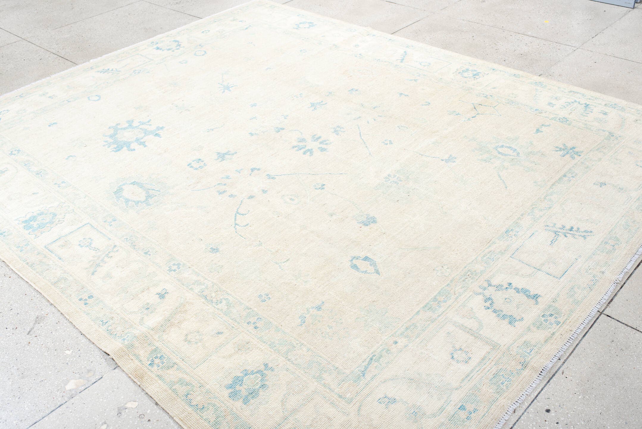 8' x 10' one-of-a-kind handmade vintage Oushak large size rug. Color palette: ivory, pale blue, cream, beige, light blue