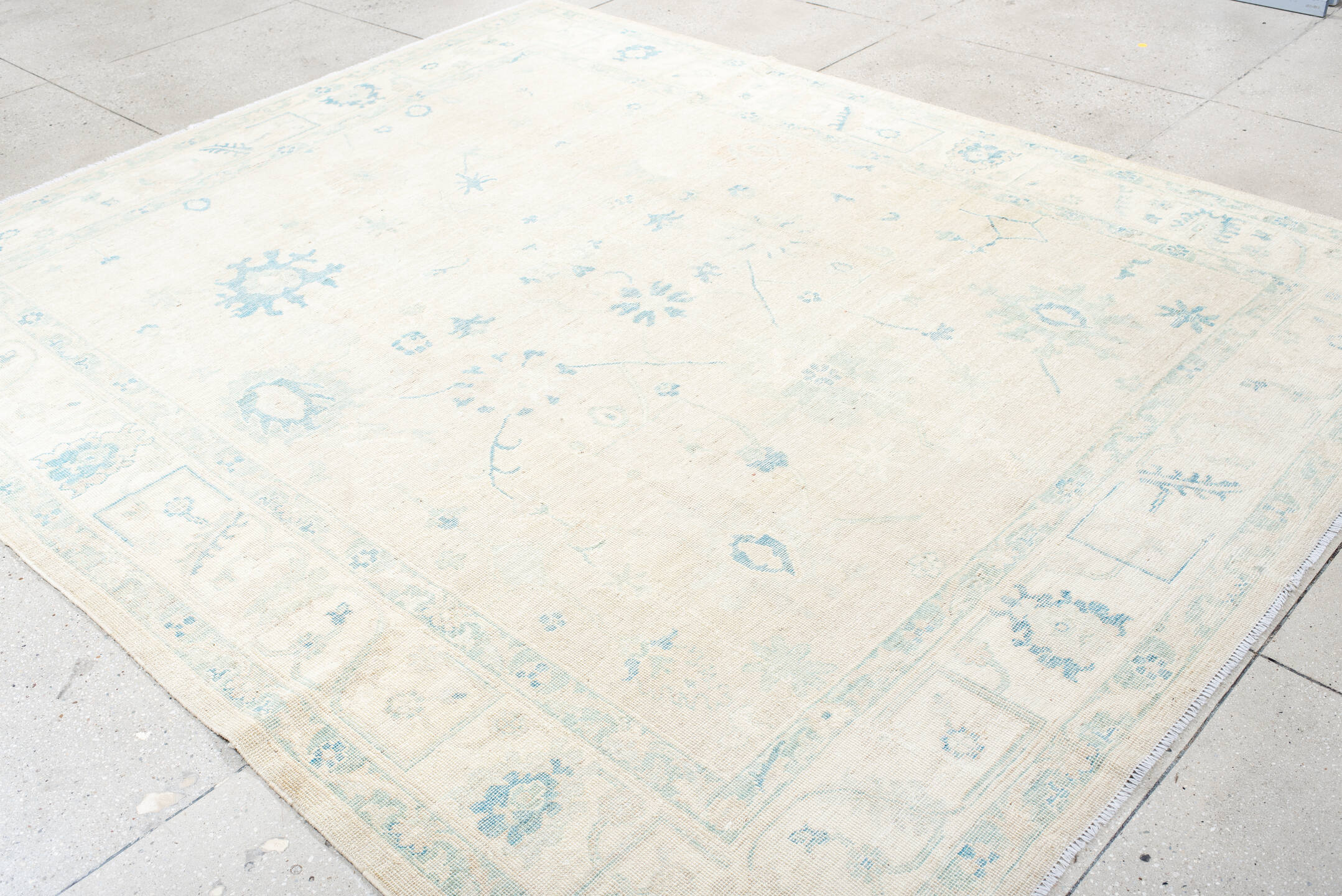 8' x 10' one-of-a-kind handmade vintage Oushak large size rug. Color palette: ivory, pale blue, cream, beige, light blue