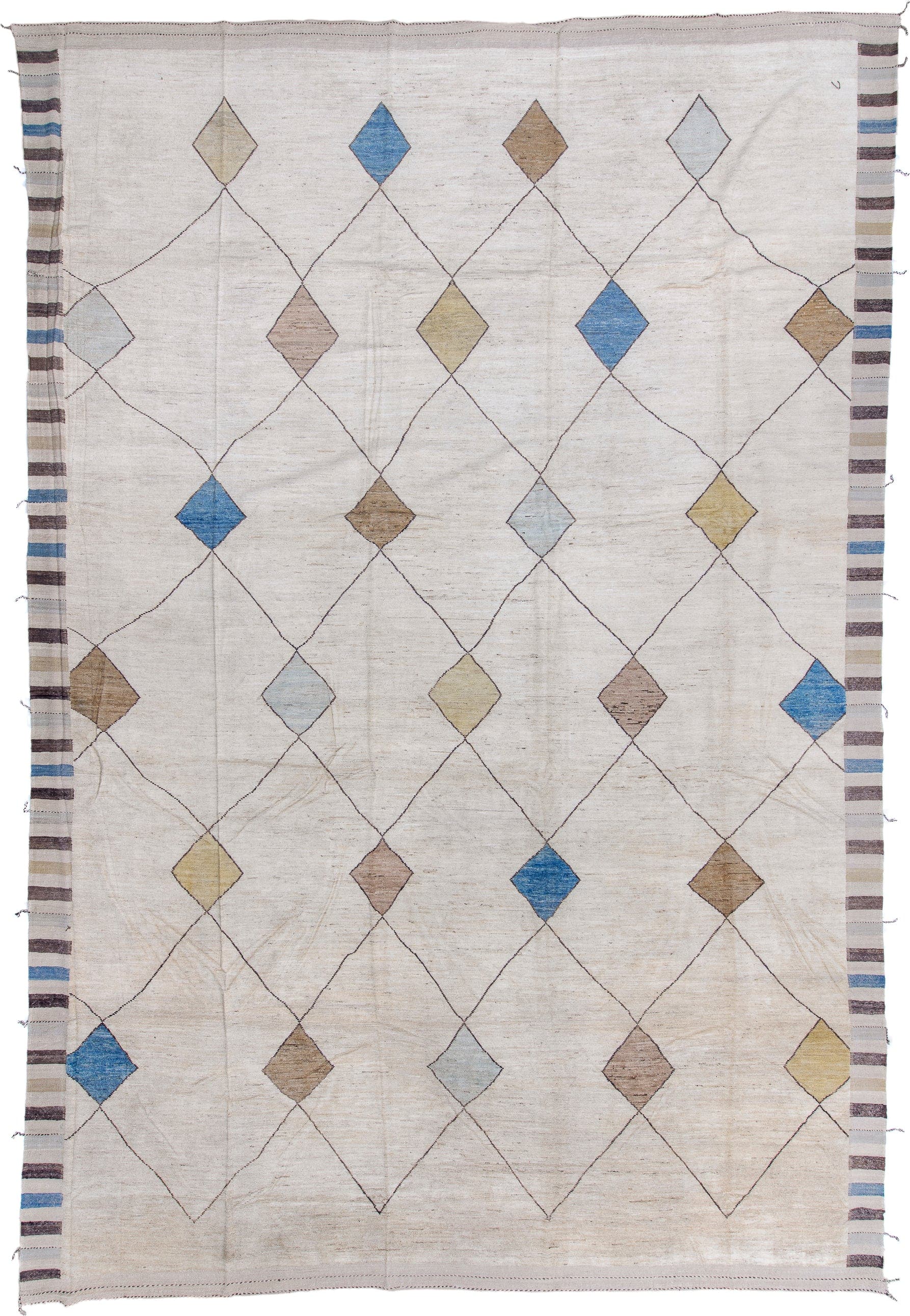 13' x 20' one-of-a-kind handmade vintage Tulu oversize rug. Color palette: ivory, taupe, camel, sky_blue, pale_gold