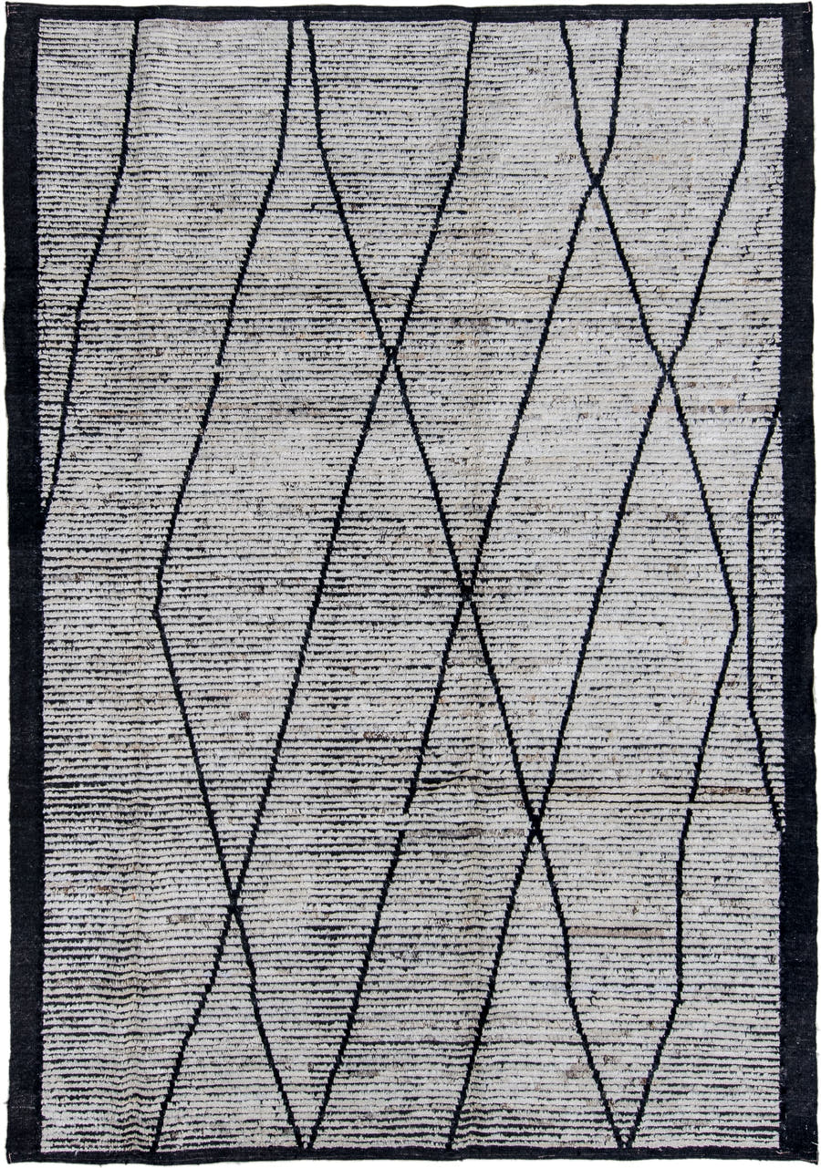 6' x 9' one-of-a-kind handmade vintage Tulu rug. Color palette: ivory, charcoal, black, gray