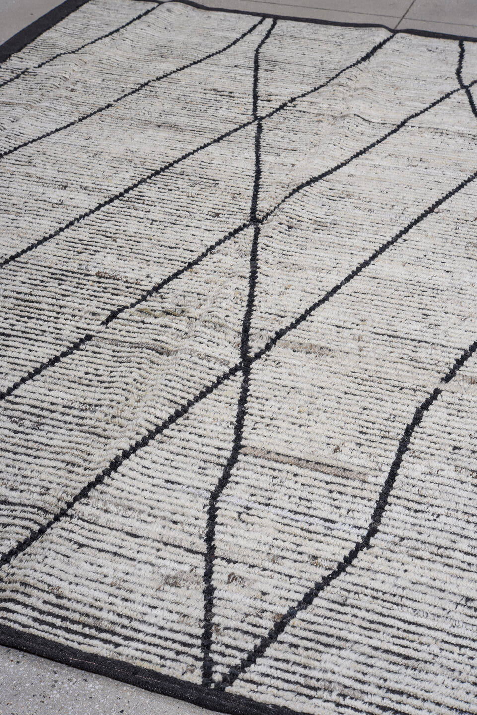 6' x 9' one-of-a-kind handmade vintage Tulu rug. Color palette: ivory, charcoal, black, gray