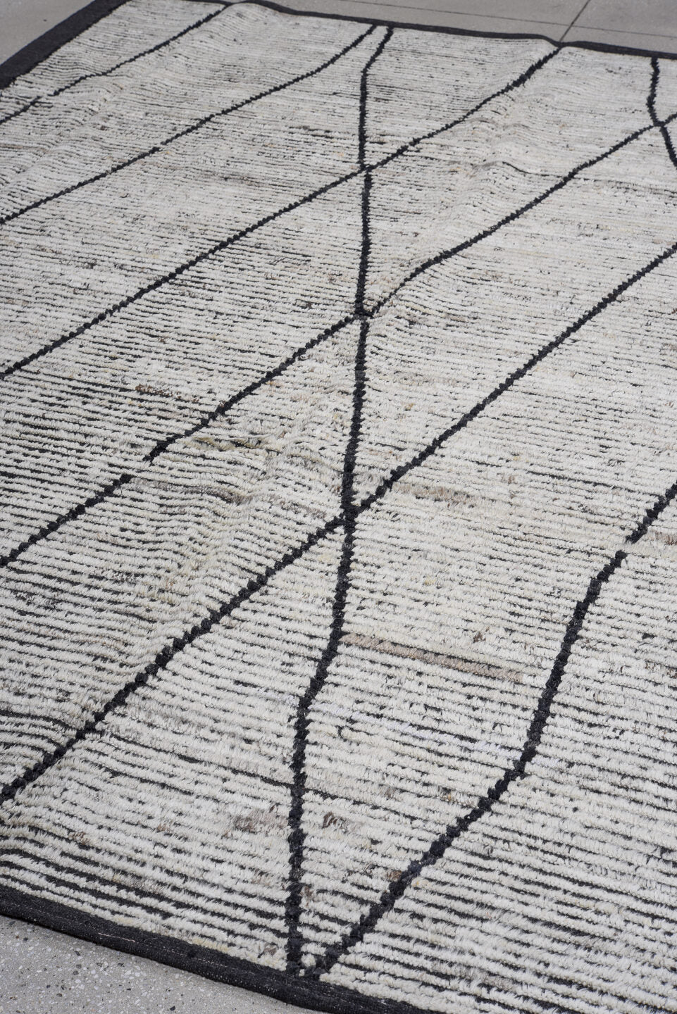 6' x 9' one-of-a-kind handmade vintage Tulu rug. Color palette: ivory, charcoal, black, gray