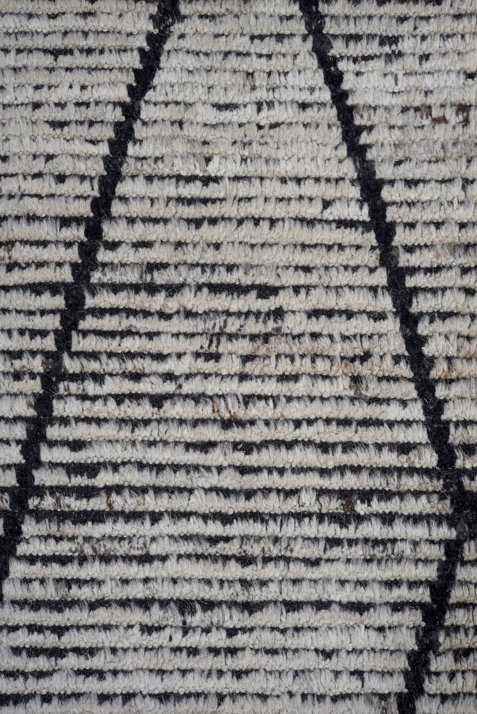 6' x 9' one-of-a-kind handmade vintage Tulu rug. Color palette: ivory, charcoal, black, gray