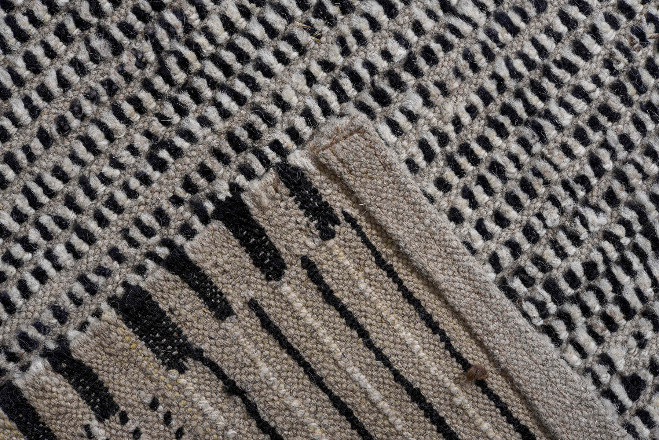 13' x 16' one-of-a-kind handmade vintage Tulu oversize rug. Color palette: ivory, charcoal, gray, black