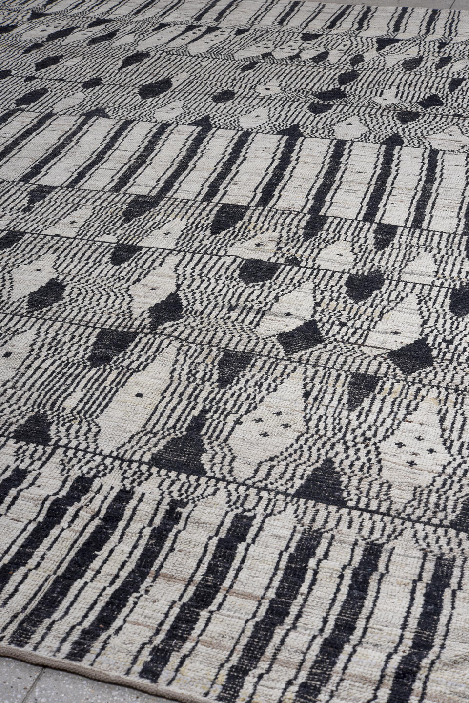 11' x 14' one-of-a-kind handmade vintage Tulu oversize rug. Color palette: ivory, charcoal, taupe, gray, black, beige