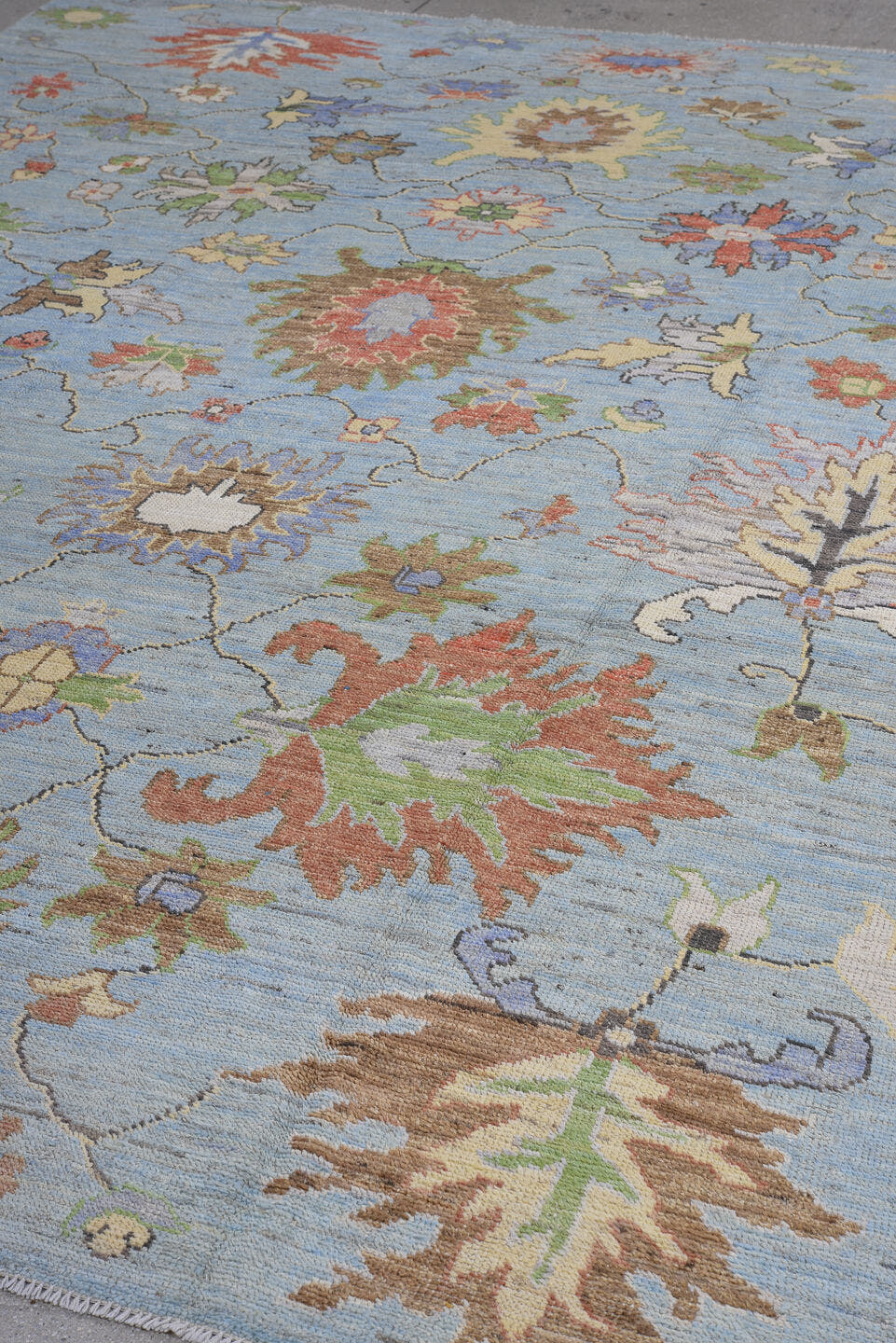 8' x 12' one-of-a-kind handmade vintage Oushak large size rug. Color palette: light blue, ivory, rust, sage, brown, lavender
