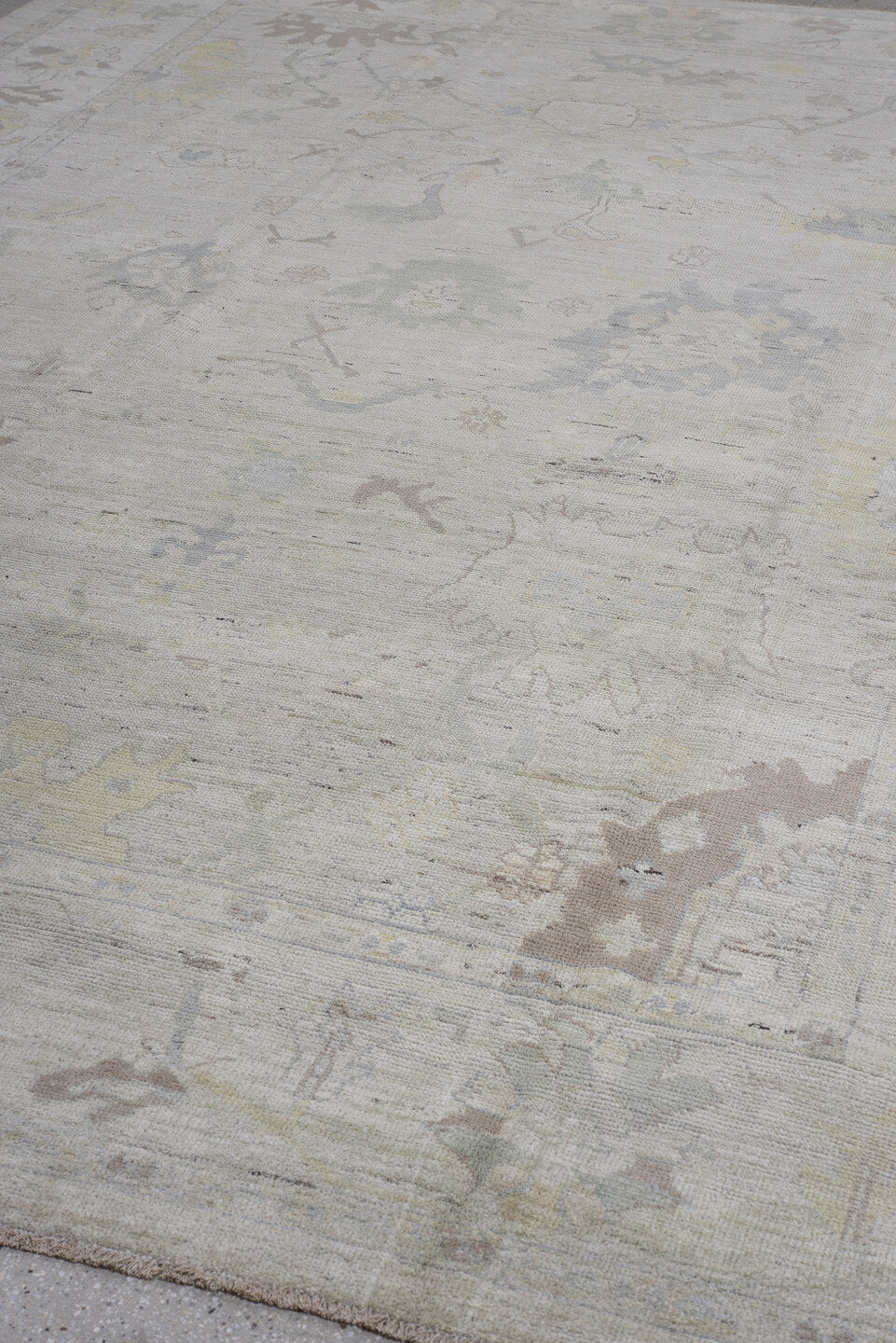 8' x 13' one-of-a-kind handmade vintage Oushak large size rug. Color palette: ivory, pale blue, taupe, sage, cream