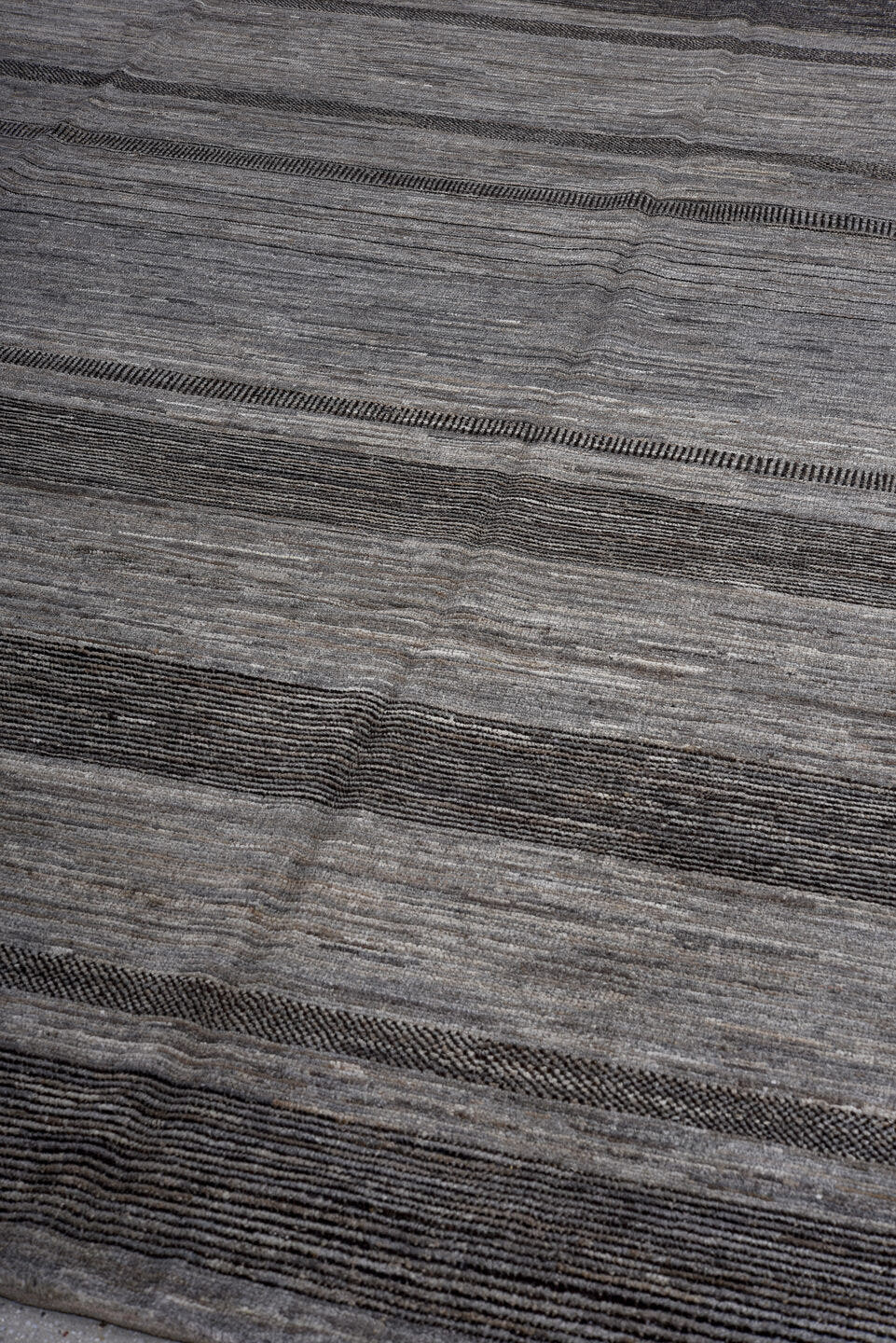 8' x 9' one-of-a-kind handmade vintage Tulu large size rug. Color palette: gray, charcoal, slate, ivory, black