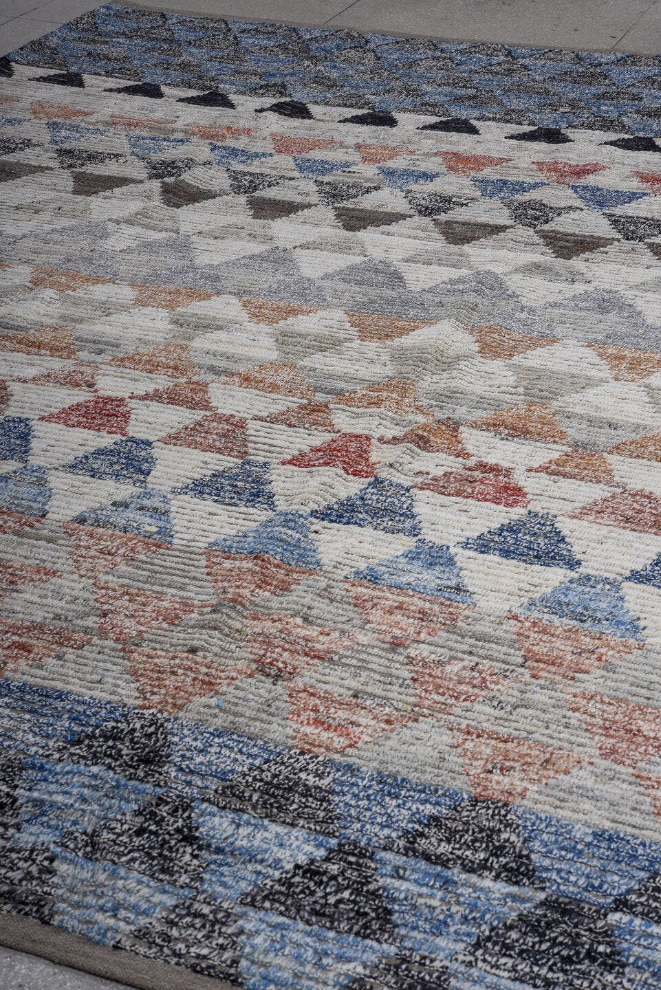 9' x 12' one-of-a-kind handmade vintage Tulu large size rug. Color palette: ivory, blue, charcoal, slate, rust, taupe