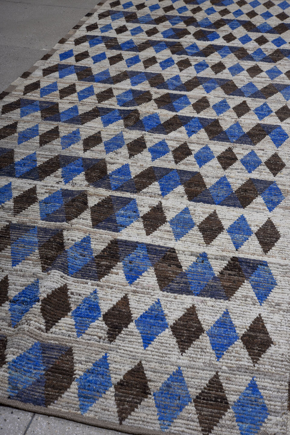 5' x 14' one-of-a-kind handmade vintage Tulu rug. Color palette: ivory, charcoal, cobalt, slate, taupe, gray, black, blue