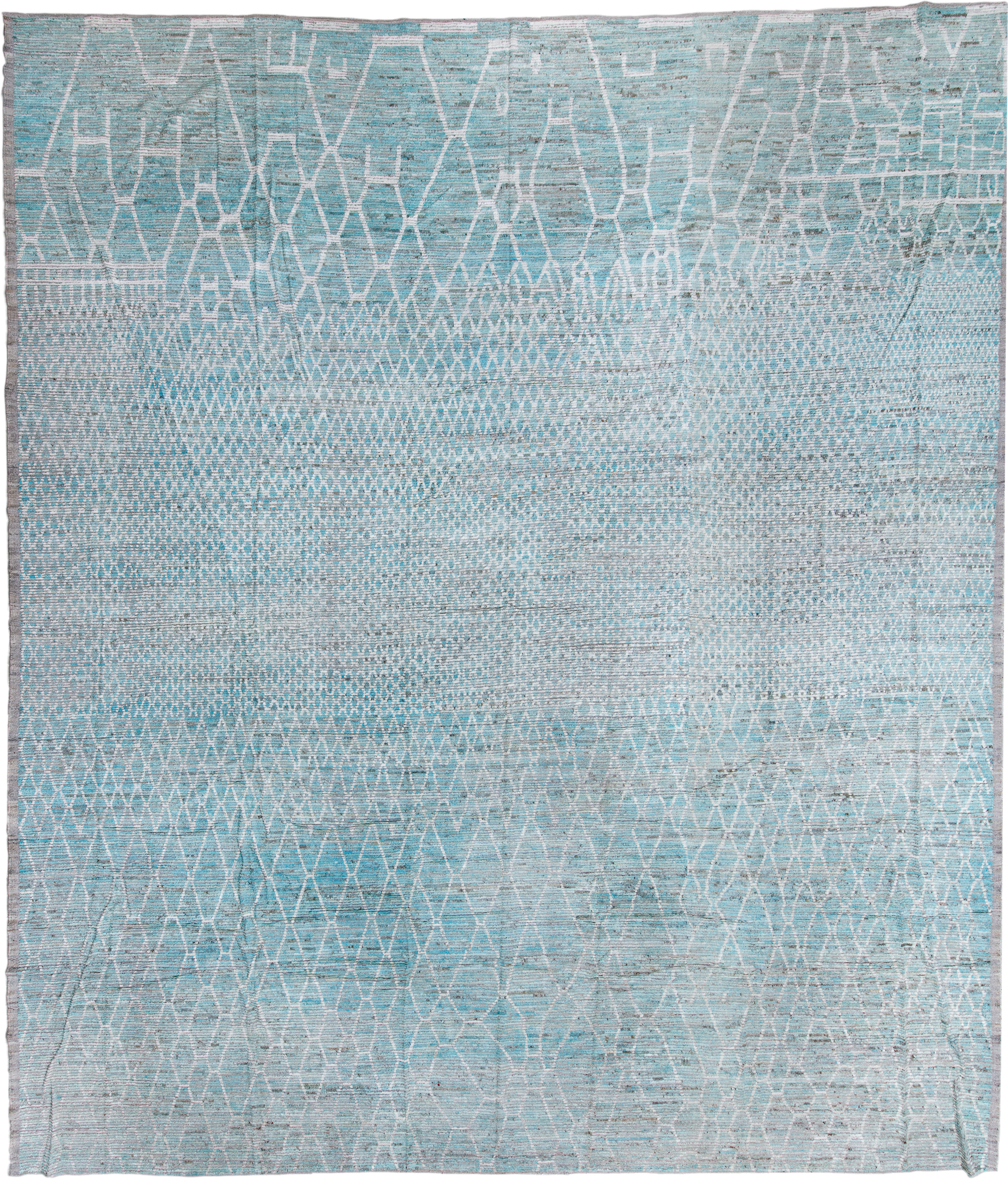 16' x 19' one-of-a-kind handmade vintage Tulu oversize rug. Color palette: pale blue, ivory, silver, gray, light blue