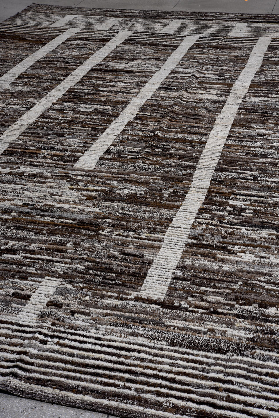 13' x 16' one-of-a-kind handmade vintage Tulu oversize rug. Color palette: charcoal, ivory, taupe, brown, slate, gray, black