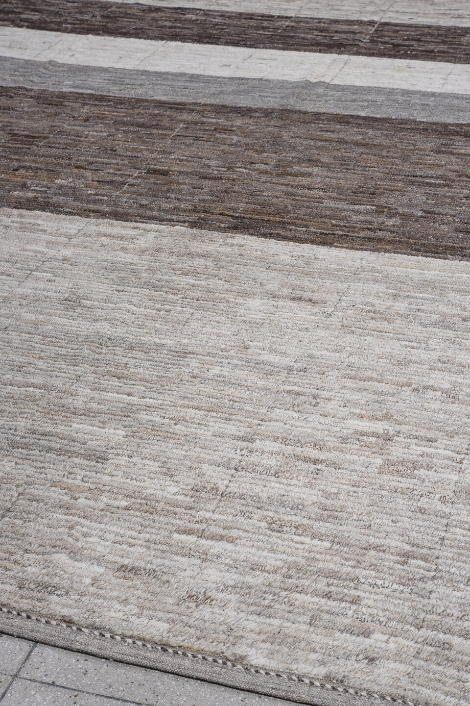 13' x 14' one-of-a-kind handmade vintage Tulu oversize rug. Color palette: ivory, charcoal, taupe, gray, brown, black, beige
