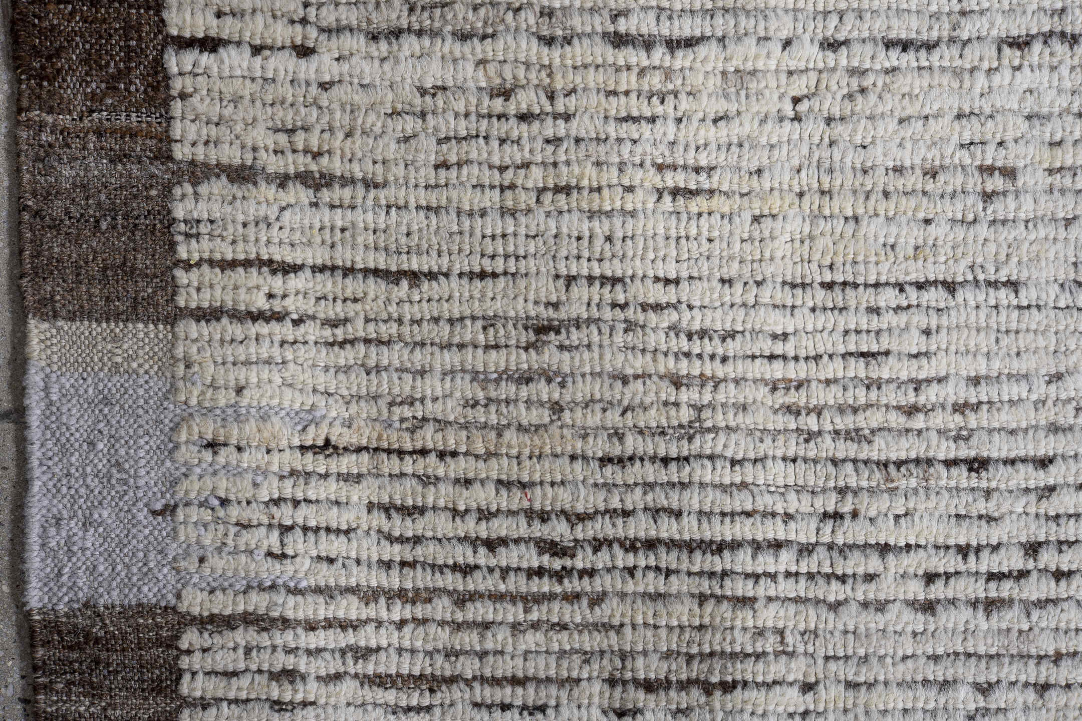 13' x 16' one-of-a-kind handmade vintage Tulu oversize rug. Color palette: ivory, charcoal, taupe, brown, gray, black, beige