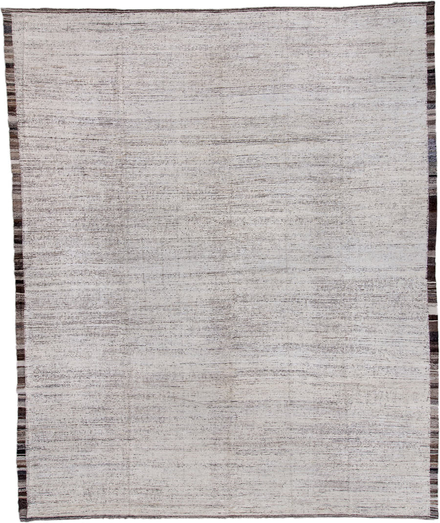 13' x 16' one-of-a-kind handmade vintage Tulu oversize rug. Color palette: ivory, charcoal, taupe, brown, gray, black, beige