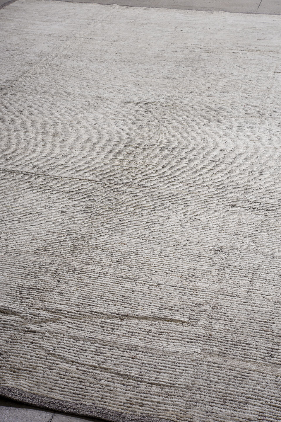13' x 16' one-of-a-kind handmade vintage Tulu oversize rug. Color palette: ivory, taupe, gray, charcoal, beige, black