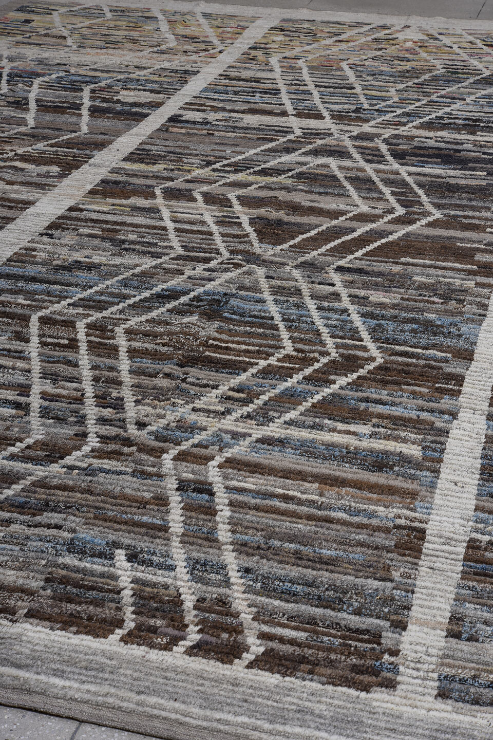 13' x 17' one-of-a-kind handmade vintage Tulu oversize rug. Color palette: taupe, ivory, charcoal, brown, slate, sky blue