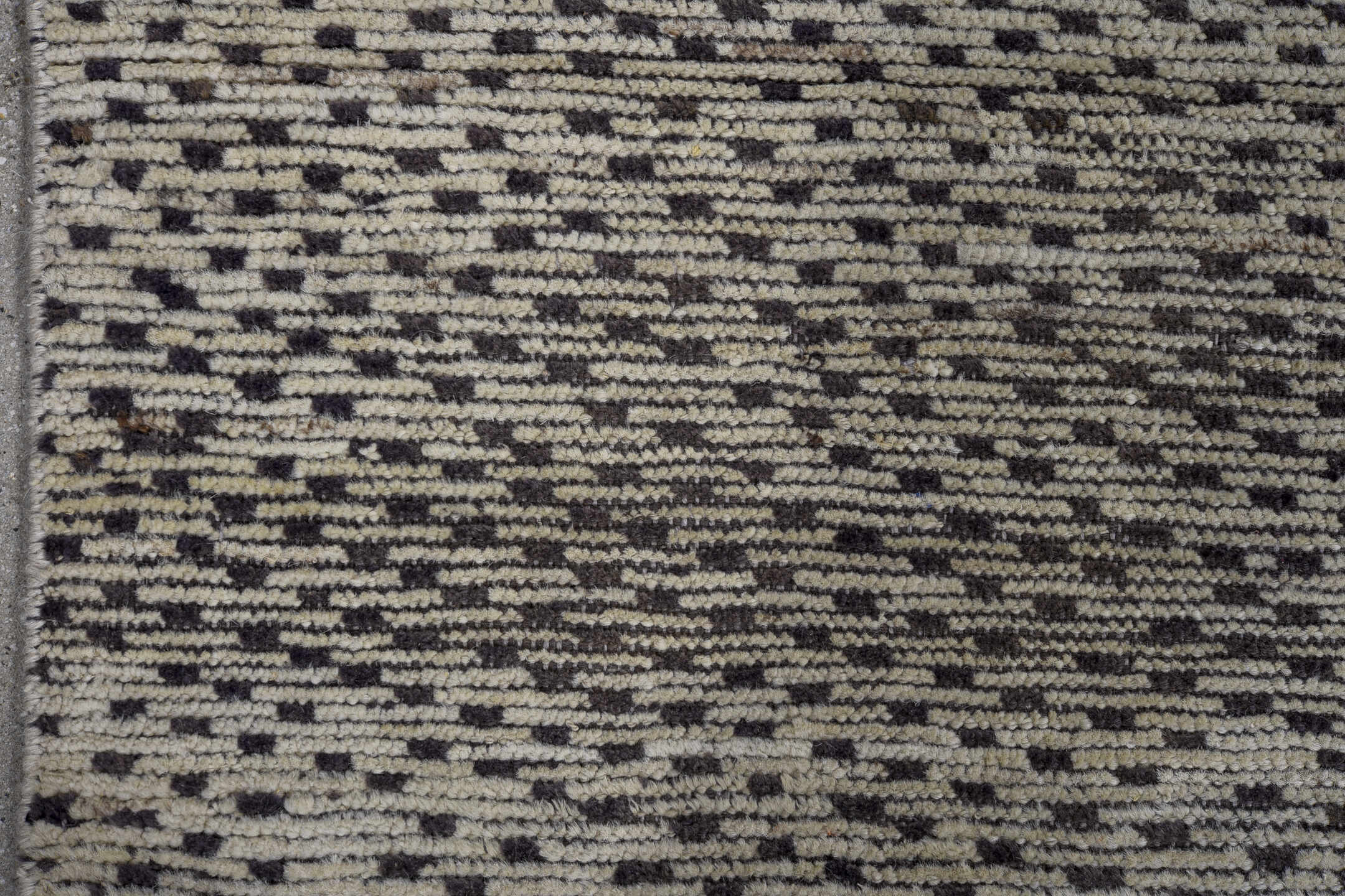 4' x 7' one-of-a-kind handmade vintage Tulu rug. Color palette: ivory, charcoal, gray, black
