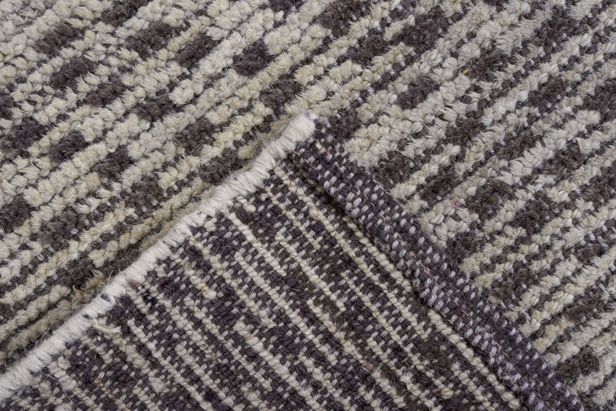 4' x 7' one-of-a-kind handmade vintage Tulu rug. Color palette: ivory, charcoal, gray, black