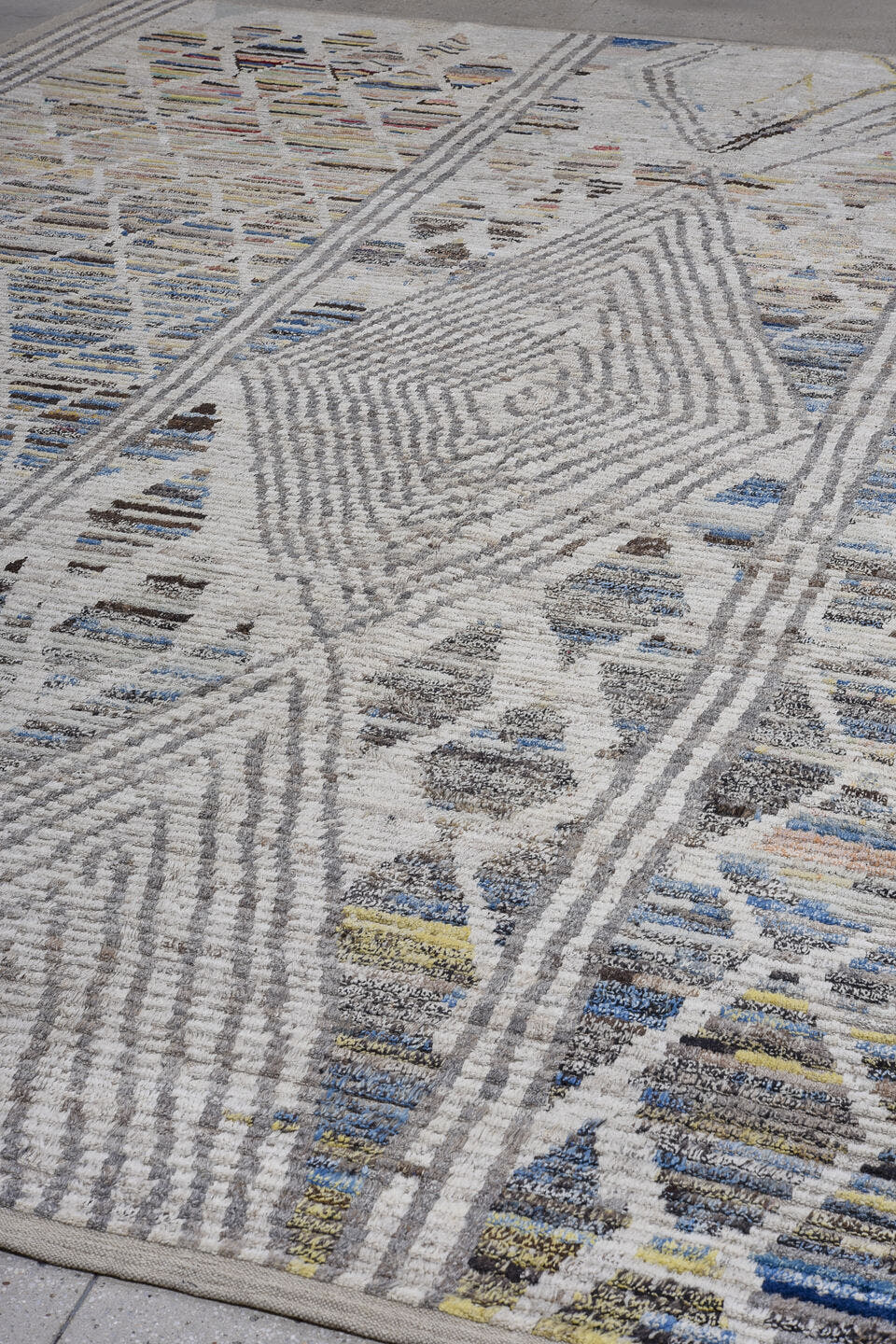 13' x 15' one-of-a-kind handmade vintage Tulu oversize rug. Color palette: ivory, gray, blue, charcoal, taupe, gold, sage