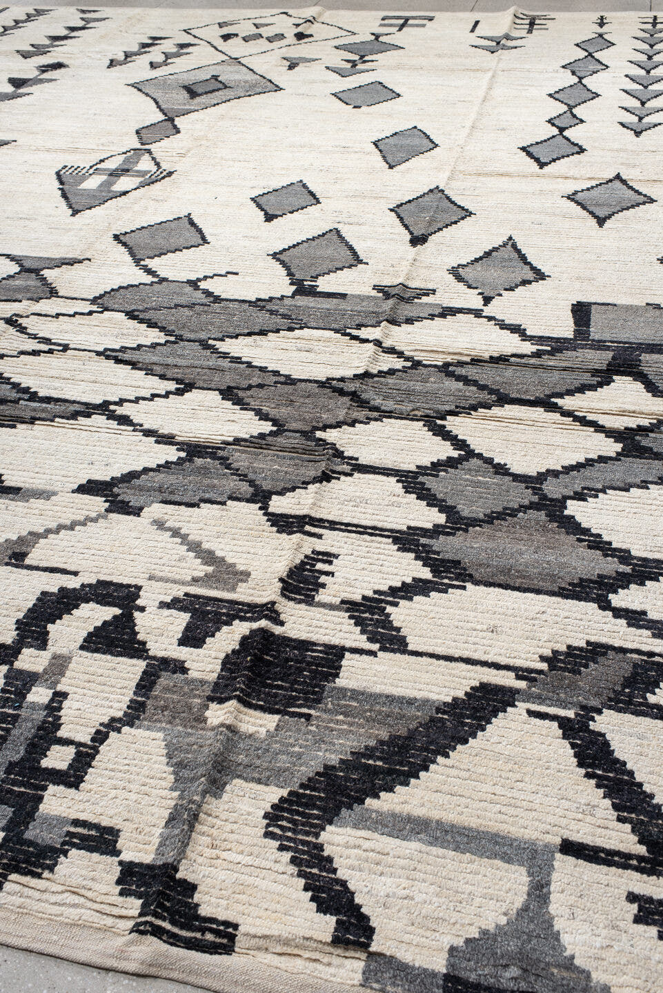 13' x 17' one-of-a-kind handmade vintage Tulu oversize rug. Color palette: ivory, charcoal, gray, black
