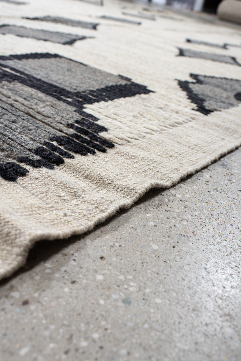 13' x 17' one-of-a-kind handmade vintage Tulu oversize rug. Color palette: ivory, charcoal, gray, black