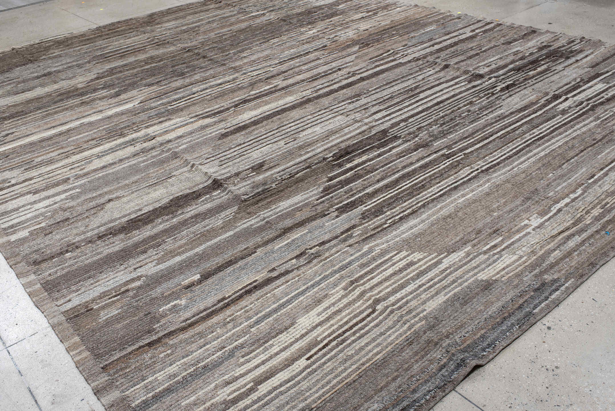 12' x 15' one-of-a-kind handmade vintage Tulu oversize rug. Color palette: black, brown, dark gray, gray, light gray, linen