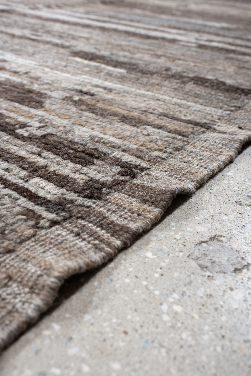 12' x 15' one-of-a-kind handmade vintage Tulu oversize rug. Color palette: black, brown, dark gray, gray, light gray, linen