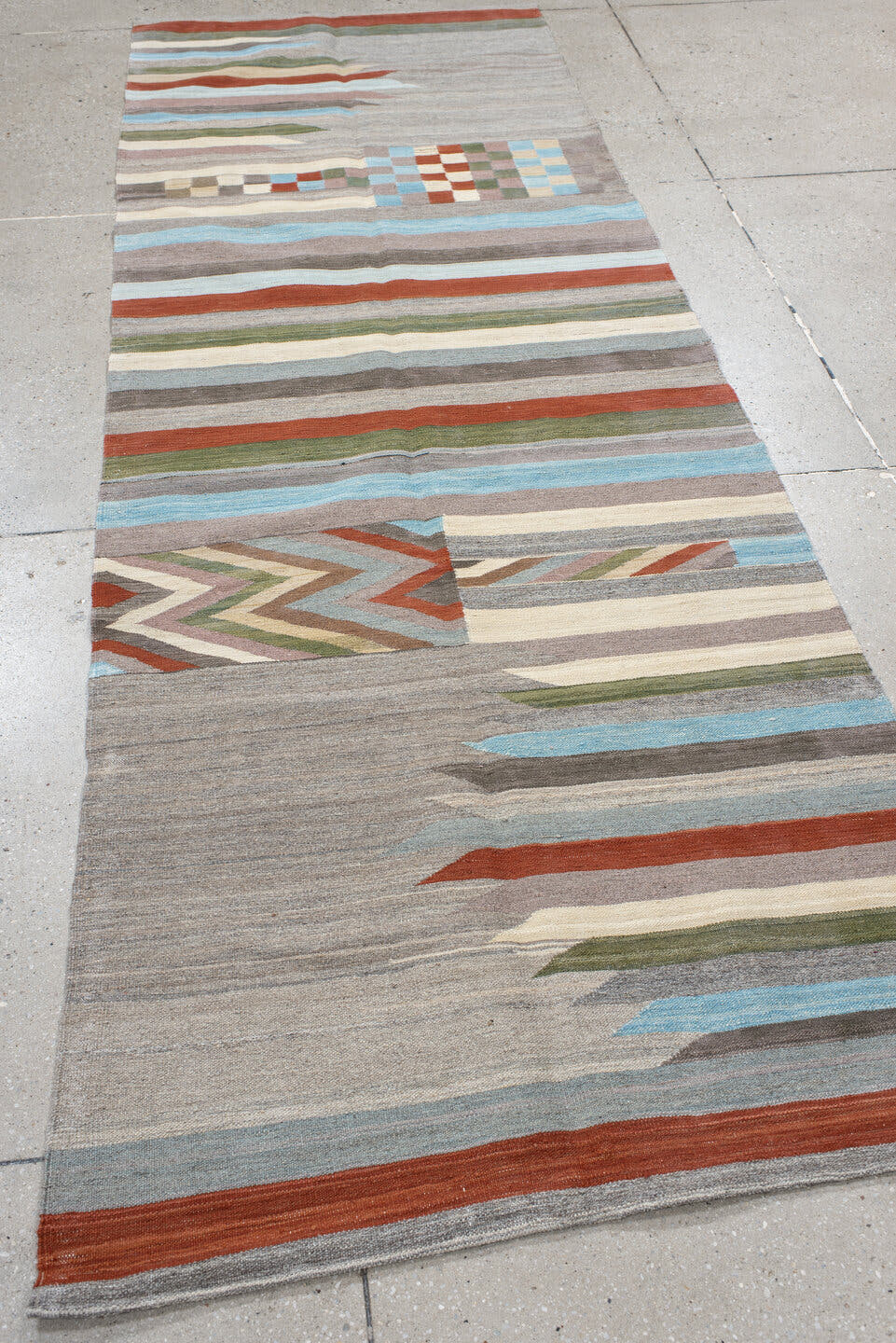 3' x 9' one-of-a-kind handmade vintage Kilim runner rug. Color palette: gray, ivory, rust, pale blue, olive, taupe, charcoal