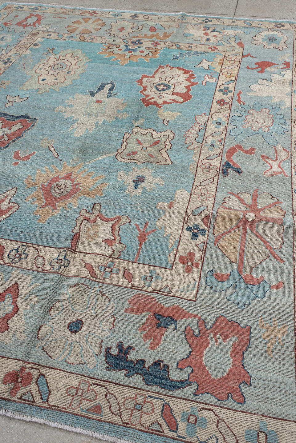 7' x 9' one-of-a-kind handmade vintage Oushak rug. Color palette: sky blue, ivory, pale blue, terra cotta, navy, beige