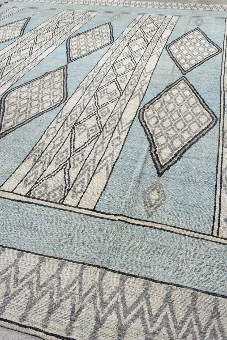 14' x 19' one-of-a-kind handmade vintage Tulu oversize rug. Color palette: pale blue, ivory, charcoal, gray, light blue