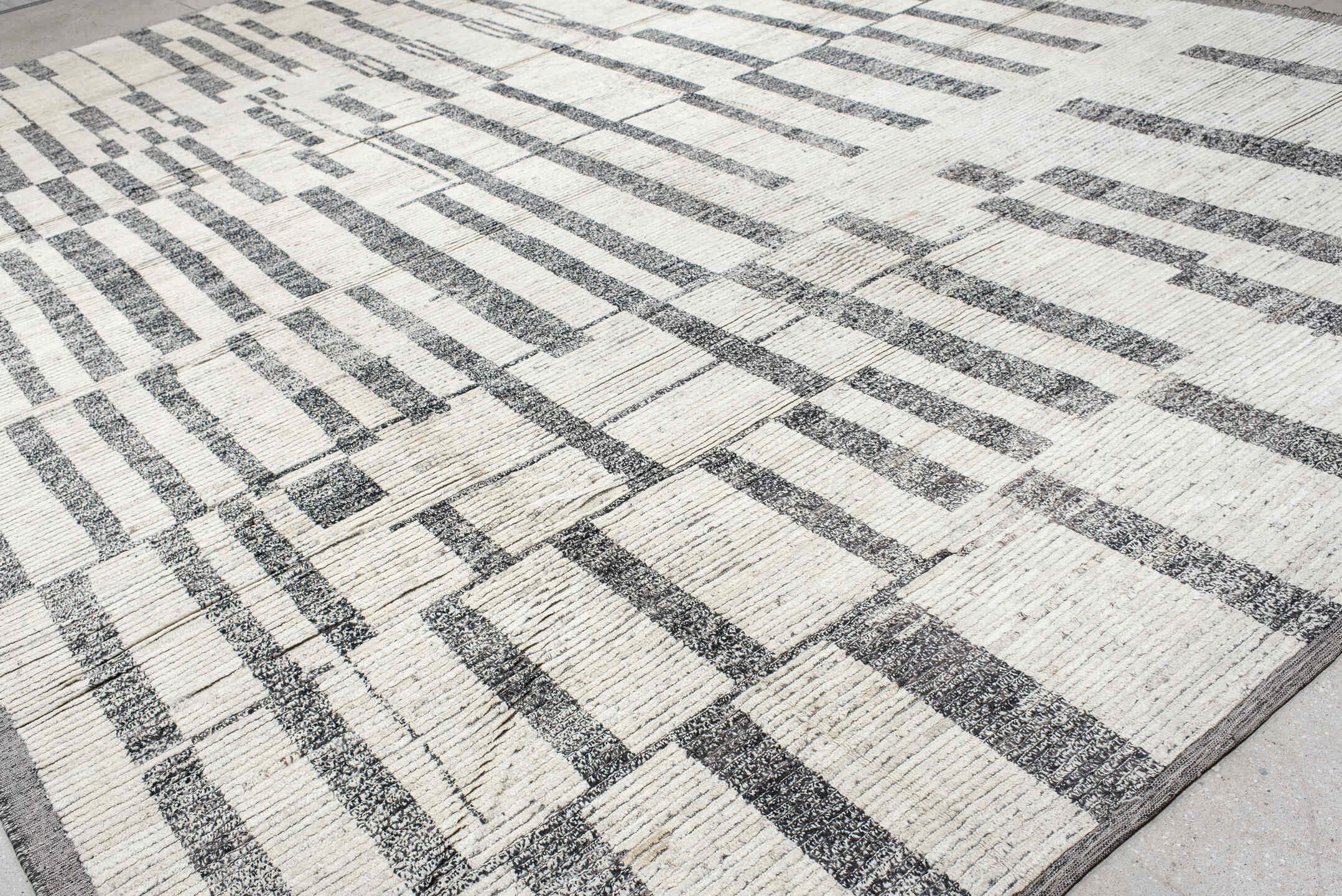 14' x 19' one-of-a-kind handmade vintage Tulu oversize rug. Color palette: ivory, charcoal, gray, black