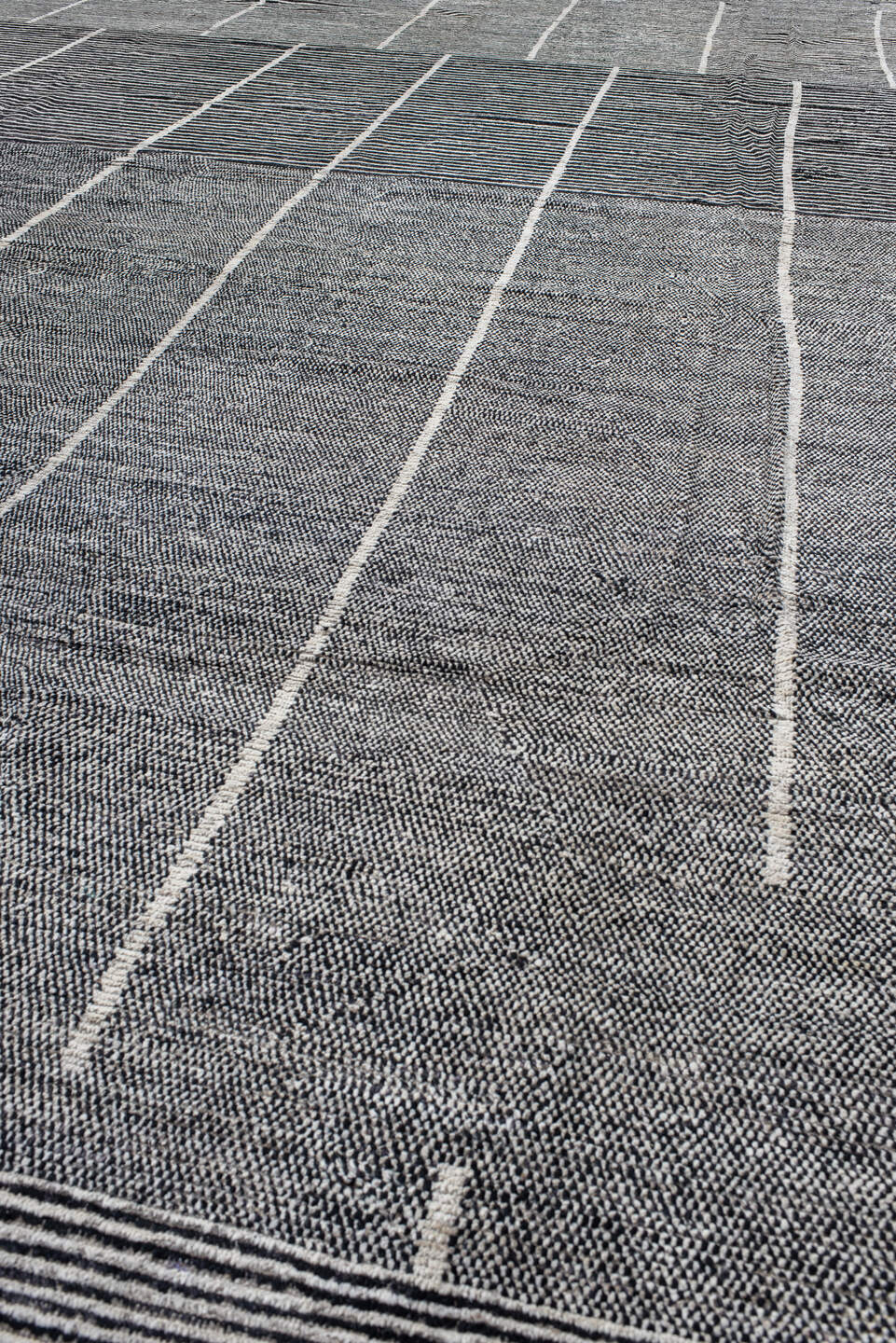 14' x 22' one-of-a-kind handmade vintage Tulu oversize rug. Color palette: charcoal, ivory, gray, black