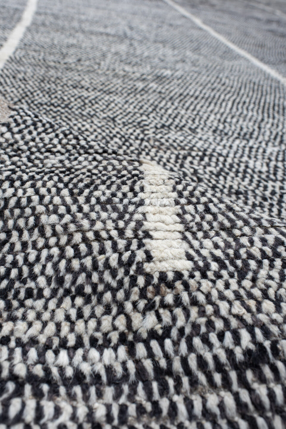 14' x 22' one-of-a-kind handmade vintage Tulu oversize rug. Color palette: charcoal, ivory, gray, black