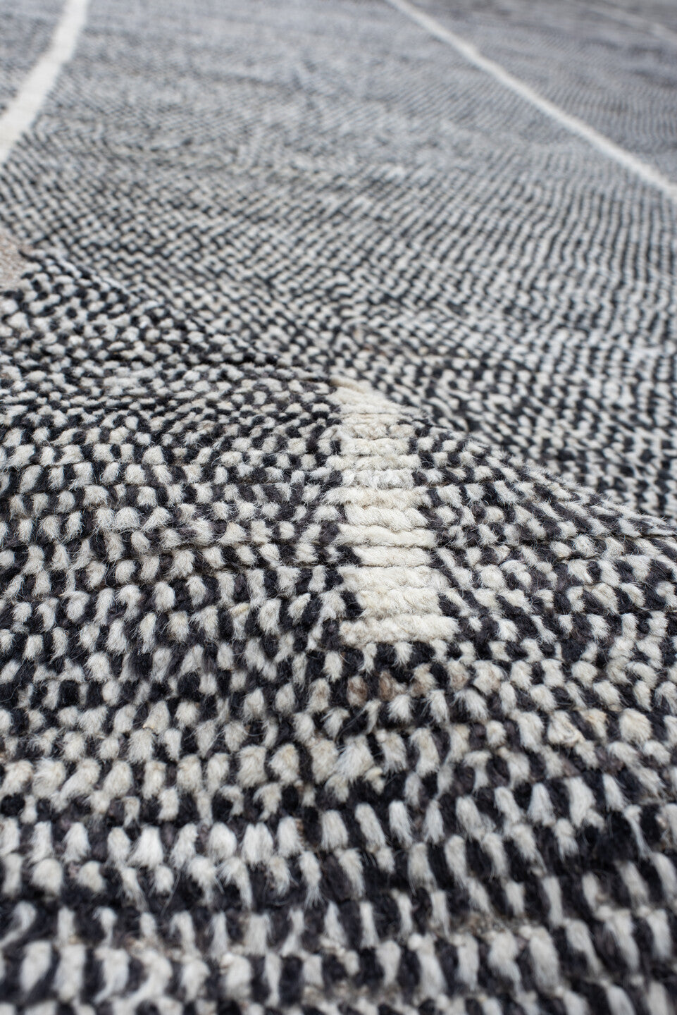 14' x 22' one-of-a-kind handmade vintage Tulu oversize rug. Color palette: charcoal, ivory, gray, black