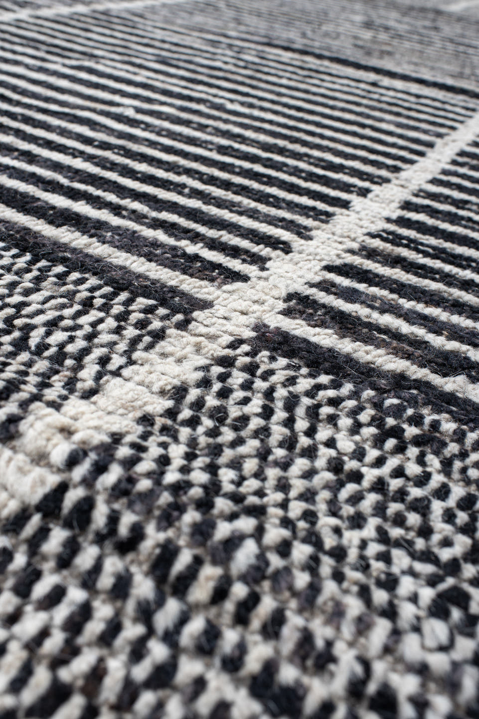 14' x 22' one-of-a-kind handmade vintage Tulu oversize rug. Color palette: charcoal, ivory, gray, black
